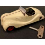 A Schuco Akustico 2002 tinplate clockwork car, unboxed with Schuco key