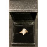 A 14ct gold diamond cluster ring, size M, 4g, boxed