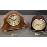 A mid-twentieth century Bakelite Enfield domed mantel clock, Arabic numerals, striking on a bell,