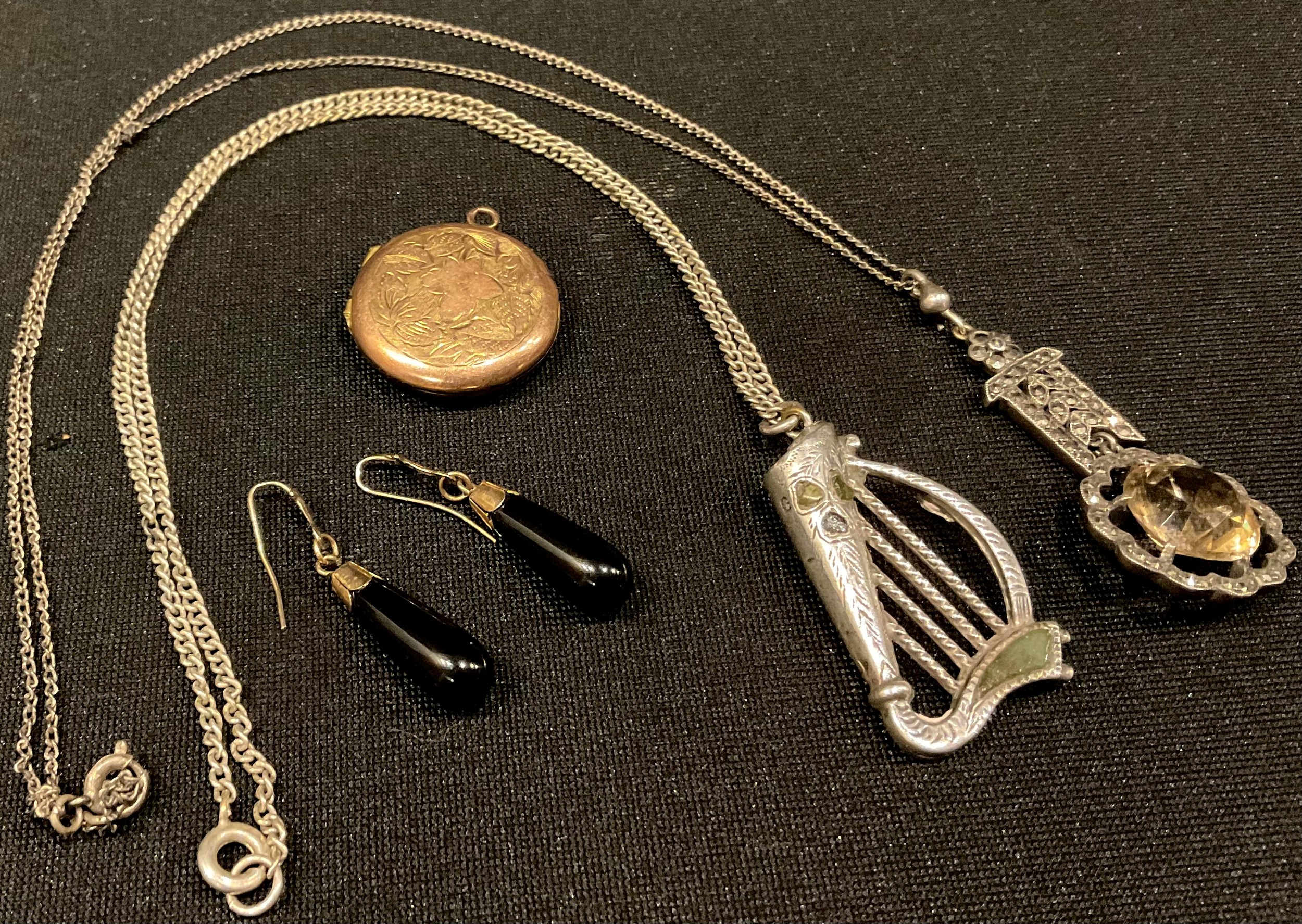 A hallmarked silver and agate set Irish harp pendant; a gold locket; gold mounted earrings and a