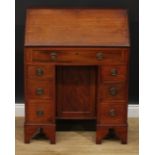 An Edwardian mahogany kneehole bureau, of George III design, ring handles, bracket feet, 99cm