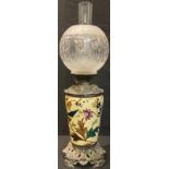 A late 19th century oil lamp, cast metal mounted Staffordshire stoneware ceramic base, Duplex twin