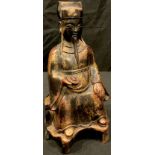 A Chinese bronzed metal figure of a seated ancestor, 23cm high