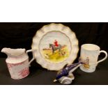 A Royal Crown Derby paperweight, Dolphin, silver stopper; a hunting scene plate, a mug "The Angler",