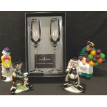 A pair of Dartington Champagne flutes, accented with Swarovski crystal elements, boxed; a Royal