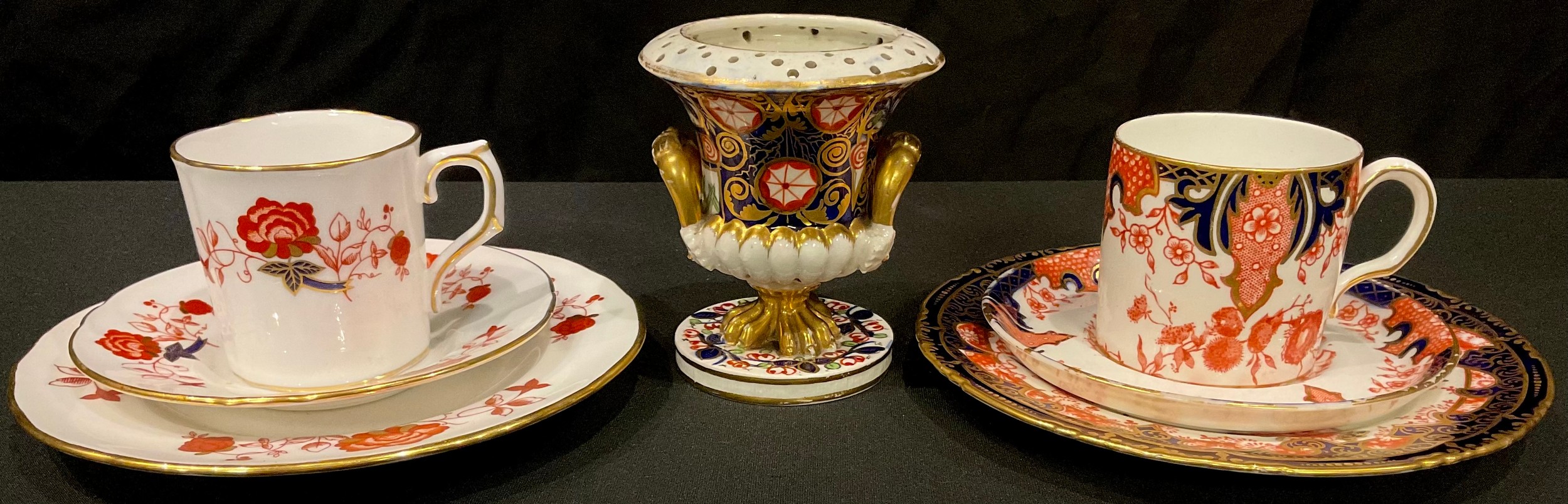 A Derby Imari palette urnular pot pourri vase, painted in red and gilt on cobalt blue ground, pair
