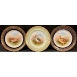 A pair of Staffordshire Brownfields shaped circular cabinet plates, painted by F Micklewright,