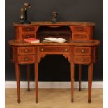 An Edwardian satinwood crossbanded kidney-shaped Carlton House type desk, shaped superstructure with