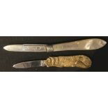 A gilt metal novelty pen knife, as a dog; an Edwardian silver and mother of pearl folding pocket