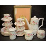 An Abbeydale coffee set for six, printed with trailing pink trumpet shaped flowers, comprising six