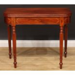 A mahogany D-shaped tea table, hinged top with channelled edge, brass strung frieze, reeded legs,