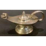 A silver novelty table lighter modelled as an Aladdin's lamp, Birmingham 1960, 11cm long