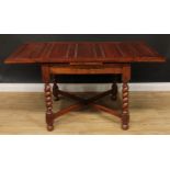 An early 20th century oak drawer-leaf dining table, barley twist supports, X-stretcher, 76cm high,