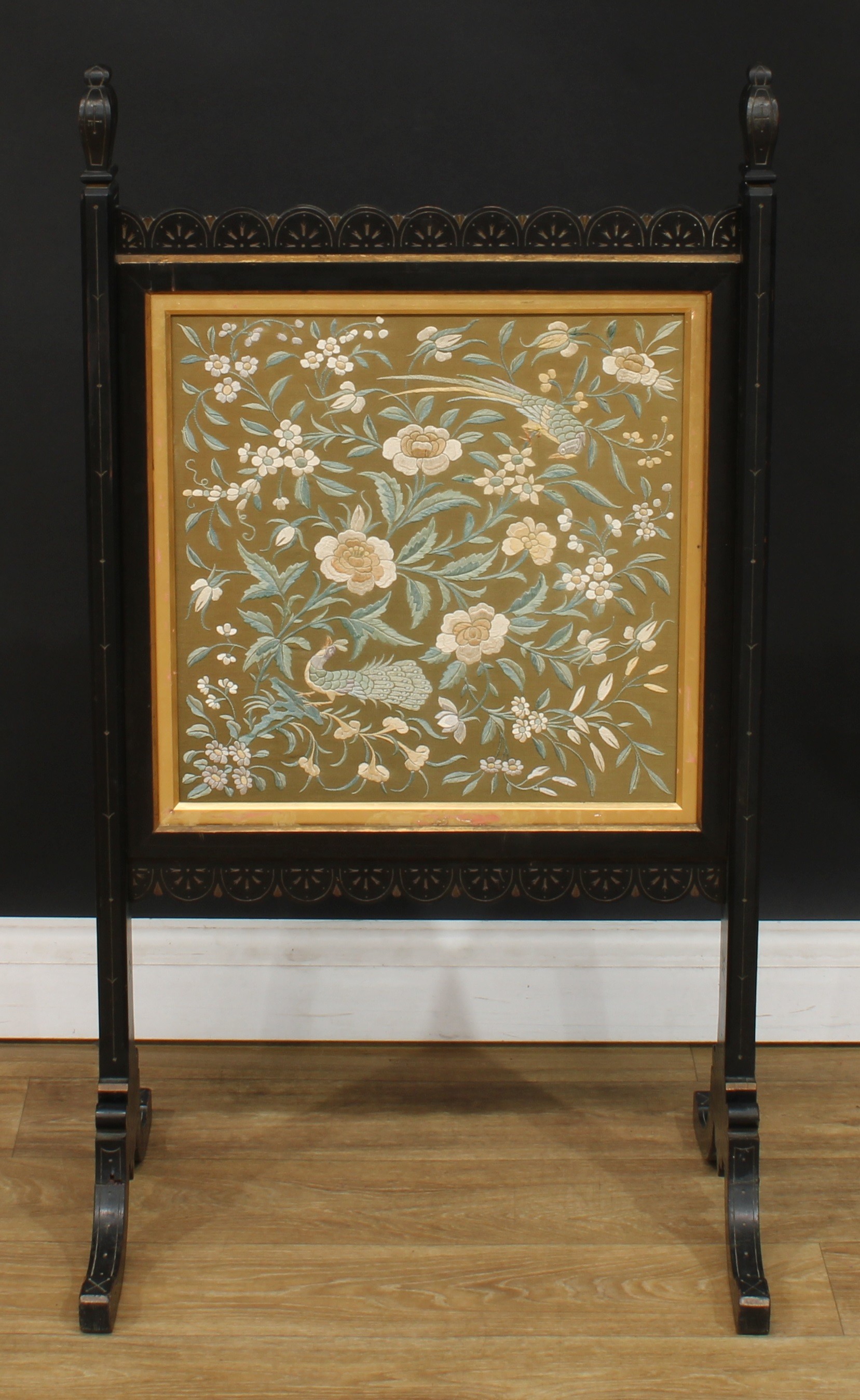 A late Victorian ebonised and parcel-gilt fire screen, 101cm high, 56cm wide