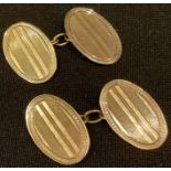 A pair of 9ct gold oval engine turned cuff links, Birmingham 1939, 4.7g