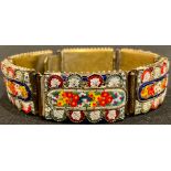 An early 20th century Italian micro mosaic bracelet. Each of the six rectangular brass panels