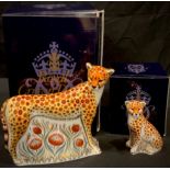 A pair of Royal Crown Derby paperweights, Cheetah and Cheetah Cub, gold stoppers, each boxed