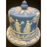 A late 19th century Jasperware cheese dome, typically sprigged with classical figures in the