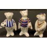 A Royal Crown Derby Teddy Bear model, Rugby Bear, 9cm, printed mark, boxed; two others, Football