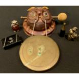 A novelty champagne bottle cigar cutter; a Mr Punch vesta case; a faux tortoise shell owl mask