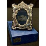 A silver easel photograph frame, 9cm high, boxed