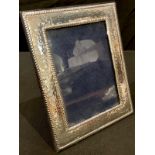 A silver easel photograph frame, 18cm high