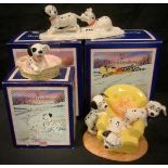 A Royal Doulton Disney 101 Dalmatians model, Pups in the Armchair, DM11, 10cm high, boxed; two