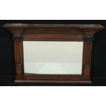 An architectural oak chimney glass, rectangular mirror plate flanked by Ionic pilasters, 74.5cm