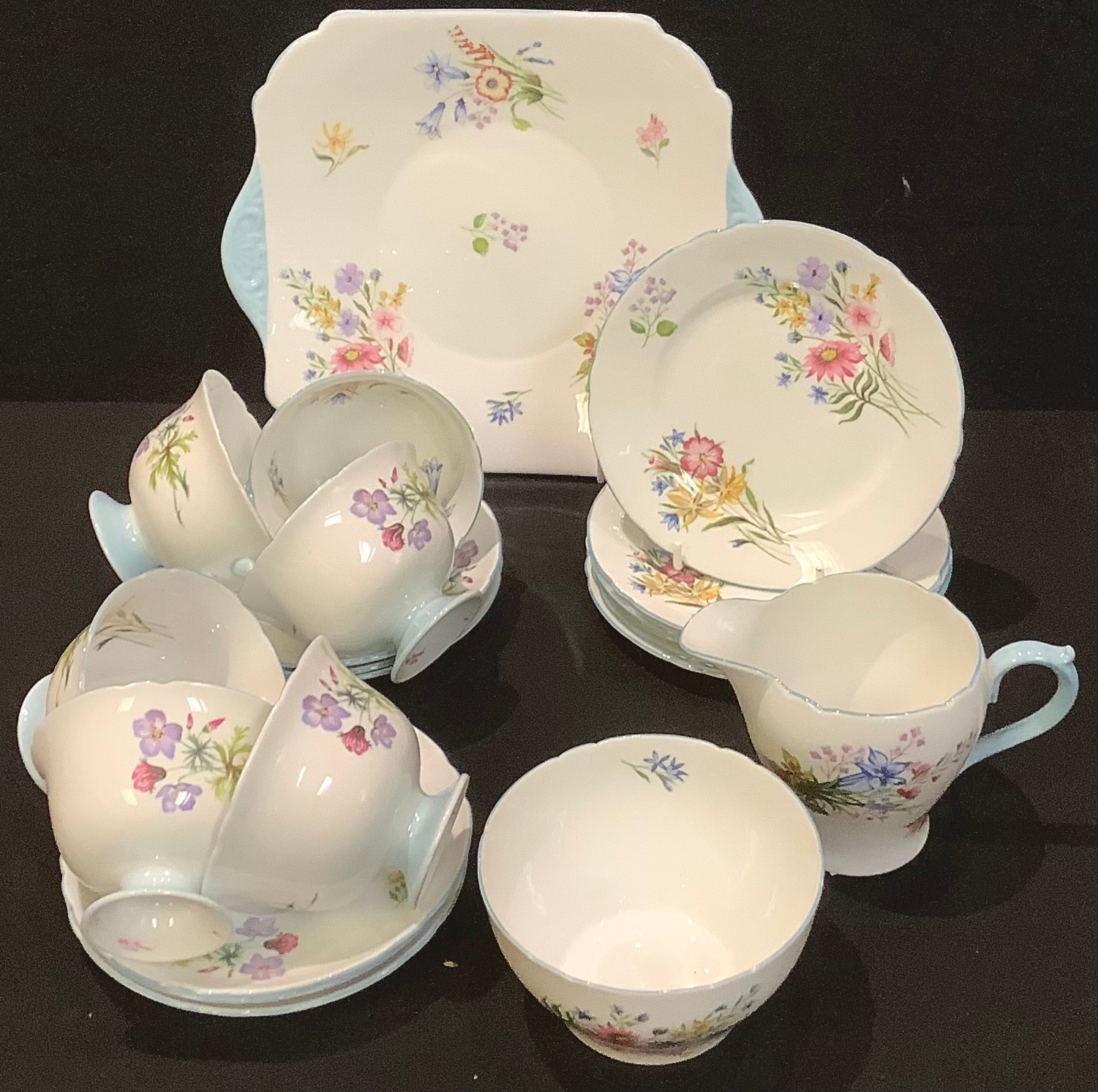 A Shelley Wild Flowers pattern tea service for six comprising cake plate, side plates, cream jug,