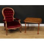 A Victorian spoonback armchair, 94cm high, 64cm wide, the seat 49cm wide and 49cm deep ; a low