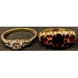 A 9ct gold illusion set three stone ring, size N, marked 375, tests as diamond, 1.8g; a 9ct gold