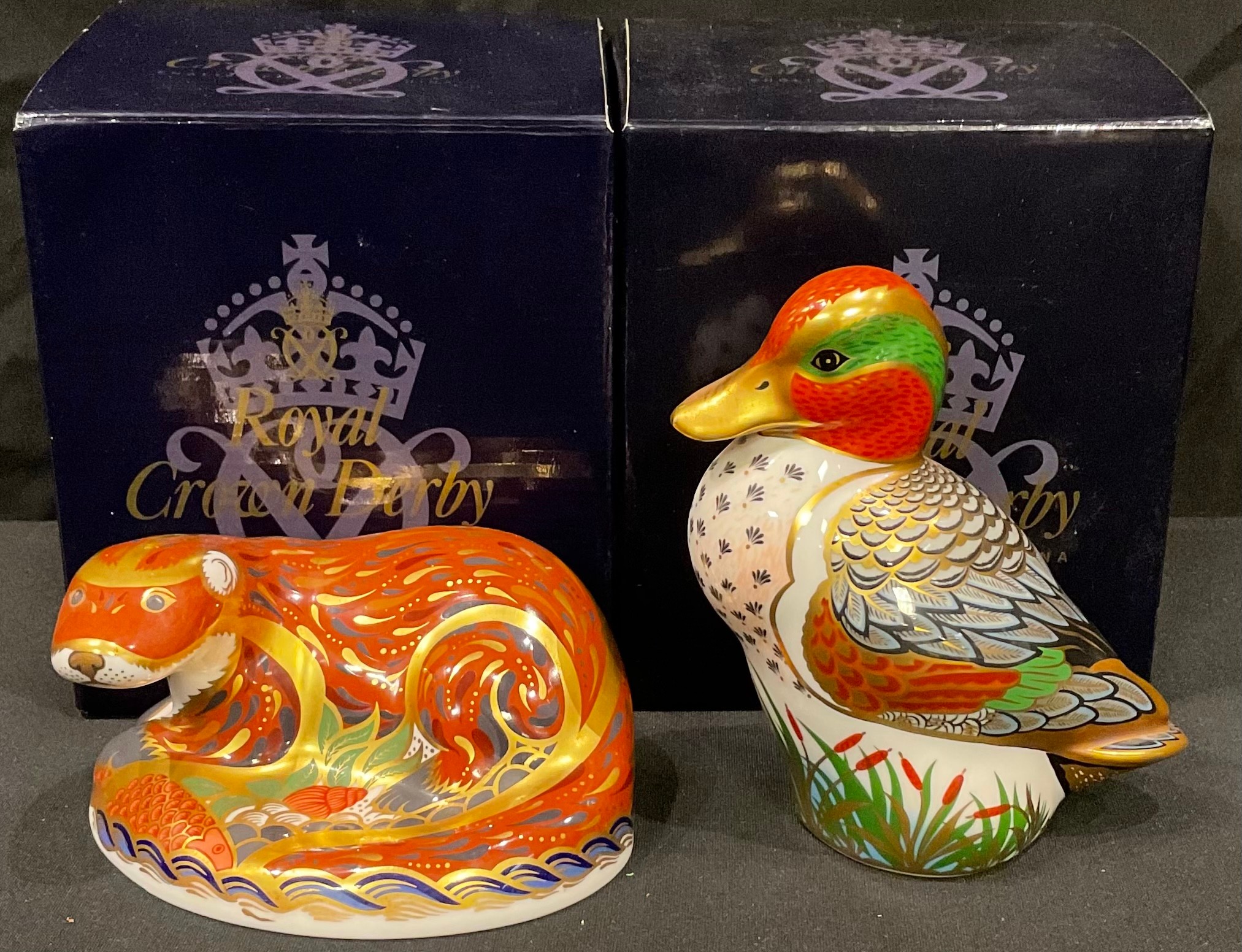 A Royal Crown Derby paperweight, Otter, gold stopper, boxed; another, Green Winged Teal, Collector's