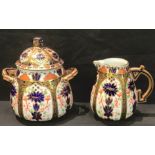 A Derby Crown Porcelain Company Imari palette 1128 pattern Aesthetic Movement cream jug, sucrier and