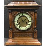 A German mahogany architectural bracket style mantel clock, ivorine chapter ring with Roman