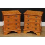 A pair of faux burr walnut chests, of small proportions, 52cm high, 42cm wide, 29.5cm deep (2)