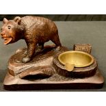 A Black Forest novelty vesta stand, carved with a bear, 15.5cm wide, early 20th century