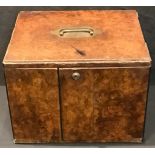 A 19th century burr walnut table cabinet, possibly apothecary, two doors enclosing two drawers,