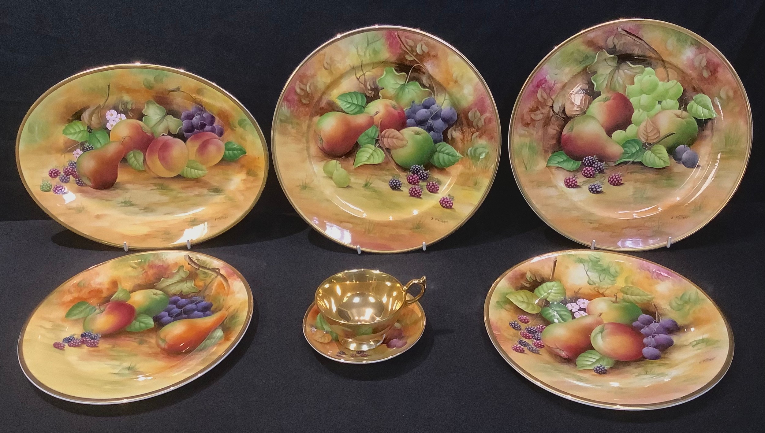 A pair of Brookdale cabinet plates painted by J Mottram, signed, decorated with ripe fruits and