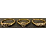 Three 18ct gold rings, set with diamond chips, 6.6g gross (3)