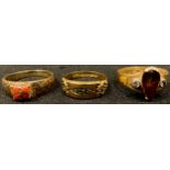 A 9ct gold three stone ring, two other 9ct gold rings, 9.8g (3)