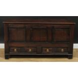 An oak mule chest, hinged top above a pair of short drawers, 76.5cm high, 144.5cm wide, 53.5cm deep