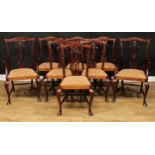 A set of eight Chippendale design dining chairs, comprising six side and a pair of carvers, the side