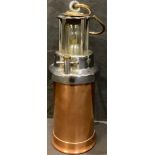 A copper CEAG patent miners lamp with 99D pit check