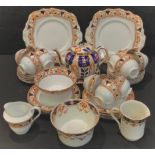 An Edwardian Balmoral China part tea service; an Imari palette teapot and stand