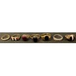 A 9ct gold bloodstone signet ring; other 9ct gold rings, some set with polished stones, 19.7g; a