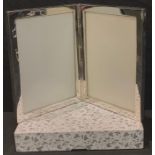 A Sterling silver double photograph frame, 14.5cm high, boxed