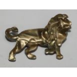 A Lea Stein, Paris, moulded plastic brooch as a prowling lion, in lustrous golden tones, 6cm long