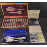 A Victorian canteen of fish knives and forks, mahogany case; a set of six silver hafted butter
