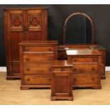 An oak bedroom suite, comprising wardrobe, 168cm high, 103.5cm wide, 48cm deep, dressing table,