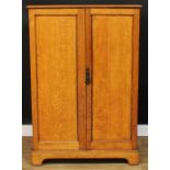 An oak hall robe, of small and neat proportions, rectangular top above a pair of panel doors,